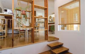 a room with wooden shelves and a dining room at Amazing Apartment In Vela Luka With 3 Bedrooms And Wifi in Vela Luka