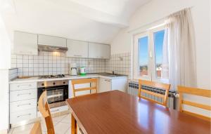 Kuchyň nebo kuchyňský kout v ubytování Apartment Don Petra Katunarica Vi