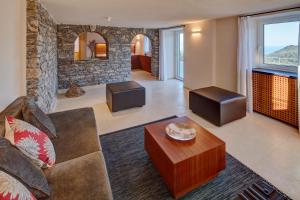 a living room with a couch and a table at Il Leccio - Luxury Resort Portofino Monte in Santa Margherita Ligure