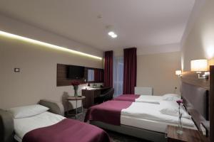 Postel nebo postele na pokoji v ubytování Hotel Silver + 27 fotografií