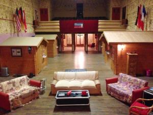 a large room with couches and a table in the middle at Maison atypique près de La Caillère-Saint-Hilaire avec jardin 500 m² in Mérigny +6 photos
