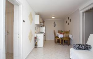 a room with a kitchen and a dining room at Amazing Apartment In Rijeka With Wifi in Rijeka
