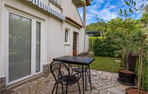 a black table and chairs on a patio at Nice Apartment In Rukavac With Wifi in Rukavac +16 photos