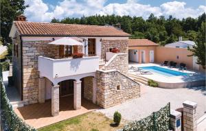 an external view of a house with a swimming pool at Lovely Home In Pazin With Wifi in Pazin