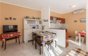 a kitchen with a table and a dining room at Holiday Home Kature Iv in Labin +20 photos