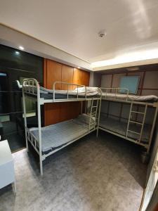 Ένα ή περισσότερα κρεβάτια σε δωμάτιο στο Dalgona Guesthouse