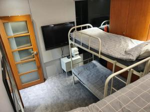 Ένα ή περισσότερα κρεβάτια σε δωμάτιο στο Dalgona Guesthouse