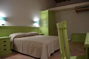 A bed or beds in a room at B&B Al Tramonto Portopalo
