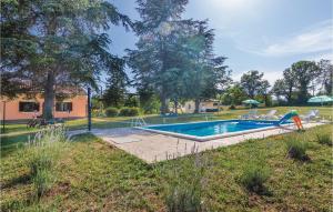 a swimming pool in the yard of a house at Beautiful Home In Krsan With Wifi in Kršan