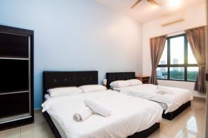 Postel nebo postele na pokoji v ubytování Designer DPulze Residence Cyberjaya By IdealHub