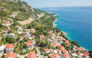 an aerial view of a village next to the ocean at Awesome Home In Omis With 8 Bedrooms, Wifi And Outdoor Swimming Pool in Omiš