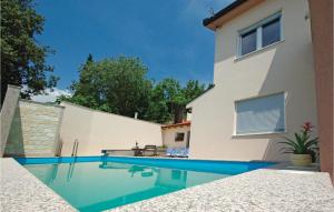 The swimming pool at or near Awesome home in Dusina w/ Outdoor swimming pool, WiFi and 4 Bedrooms