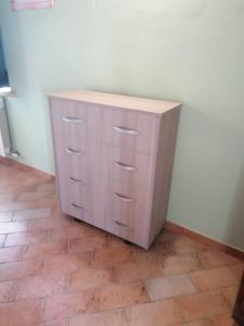 a dresser in the corner of a room at Casale Poggio Meone in Santa Luce