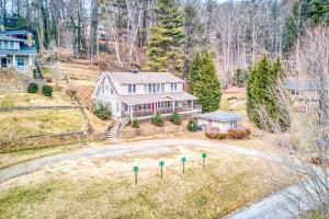an aerial view of a house with a yard at Junaluska Lodge in Lake Junaluska