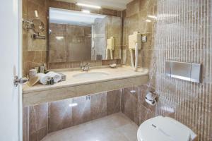 Et badeværelse på Aldino Hotel & Spa