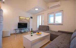 a living room with a couch and a table at 1 Bedroom Awesome Apartment In Stari Grad in Stari Grad