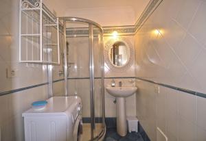 a bathroom with a shower and a sink and a toilet at Braschi Amalfi Dreams in Minori +12 photos
