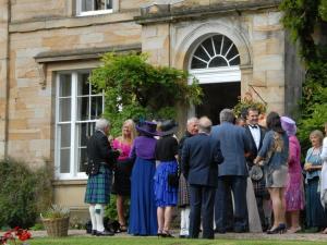 a group of people standing outside of a building at Burnhopeside Hall in Lanchester