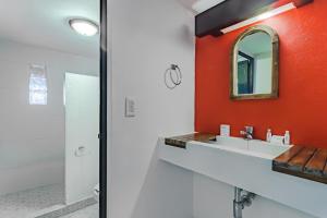 a bathroom with a sink and a mirror at Capital O Hotel Meson Del Rio, Tepotzotlan in Tepotzotlán +48 photos