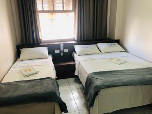 En eller flere senger på et rom på Hotel Cruz de Aviz