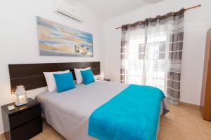 מיטה או מיטות בחדר ב-Apartamento Praia Fuseta 3 - Ria Formosa
