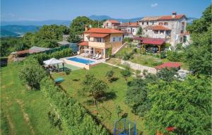 an aerial view of a house with a swimming pool at Amazing Home In Krsan With Sauna in Kršan
