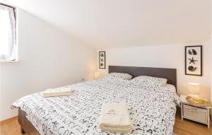 Postel nebo postele na pokoji v ubytování Apartment Medulin Katikulic Iv