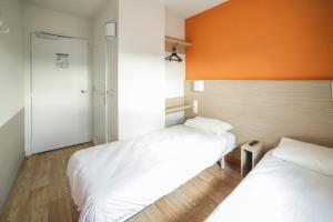 Postel nebo postele na pokoji v ubytování Premiere Classe Troyes Sud - Parc St Thibault