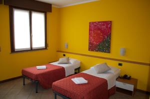 Tempat tidur dalam kamar di Hotel Mantova Sud