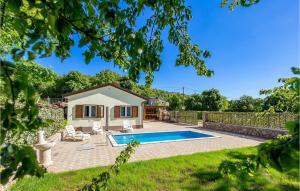 a house with a swimming pool in a yard at Gorgeous Home In Rukavac With Kitchen in Rukavac +24 photos