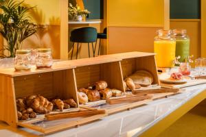 a table topped with lots of different types of bread at BYPILLOW Mothern in Barcelona