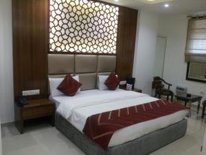 Postel nebo postele na pokoji v ubytování Hotel Sita International