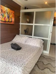 a bedroom with a bed with a large headboard at Tagaytay Prime Residence -Cityland in Tagaytay