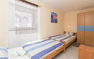 Posteľ alebo postele v izbe v ubytovaní Two-Bedroom Holiday Home In Zadar
