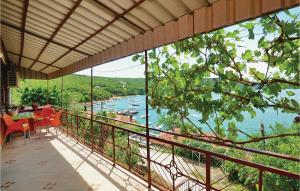 a balcony with a view of a river at Pet Friendly Home In Trget With House Sea View in Trget