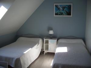 Postel nebo postele na pokoji v ubytování Gîte La Fortaiserie