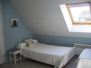 Postel nebo postele na pokoji v ubytování Gîte La Fortaiserie