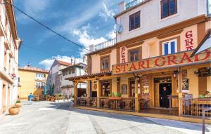 a building with a star grand restaurant on a street at Stunning Apartment In Senj With Wifi in Senj