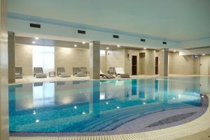a large swimming pool in a large building at Boutique Hotel Tatiana Provence in Zvenigorod