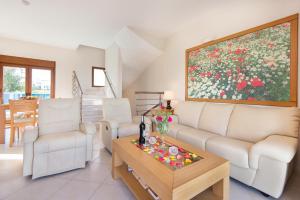 a living room with a couch and a table at Horizon Line Villas in Kiotari