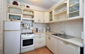 Kuchyň nebo kuchyňský kout v ubytování Apartment Stara Riva L-531