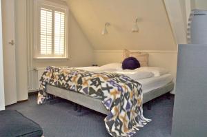 - une chambre avec un lit pour une personne dans l'établissement De Herberg, à Renesse