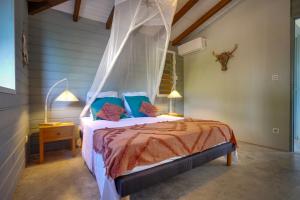 Кровать или кровати в номере Villa Ô Perchée