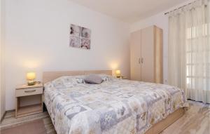 a bedroom with a large bed and two night stands at Apartment Banici Ii in Slano