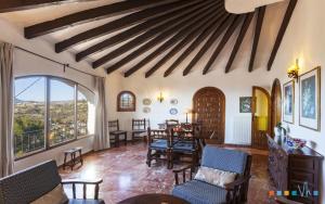 a living room with a table and chairs at VH CostaBlanca - RULLE in Benissa