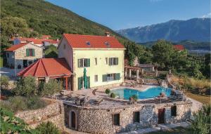 A view of the pool at Seven-Bedroom Holiday Home in Grabovac or nearby