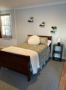 a bedroom with a bed with a pillow on it at Welcome to Columbia!-enjoy this tranquil space in Columbia