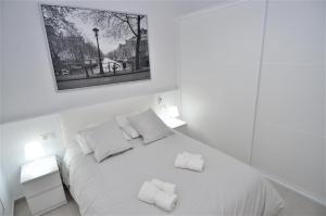 Łóżko lub łóżka w pokoju w obiekcie ALVAREZ Centro Histórico