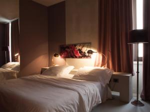 Postel nebo postele na pokoji v ubytování Hotel Locanda del Benaco