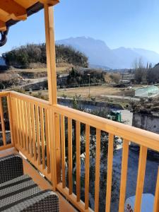 a view from the deck of a house with a view of the mountains at Appartamenti Piccolo Borgo in Arco